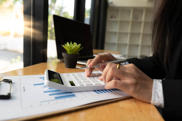 istock bookkeeper or financial inspector hands making report, calculating or checking balance. Home finances, investment, economy, saving money or insurance concept 1314491833