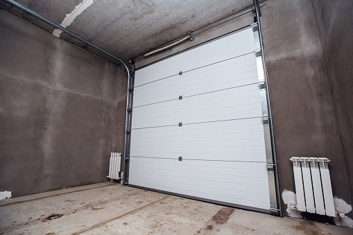 large car garage with sectional doors
