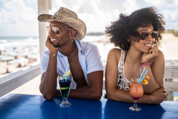 istock Young afro couple enjoying their holiday on the beach 1314493174