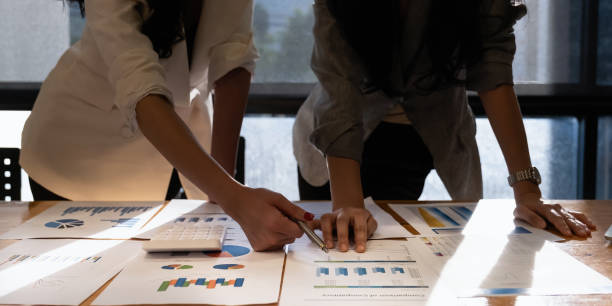 istock Analytics intelligence concept. Group of business people discuss current financial and economic paperwork for investment at the meeting. 1314493400