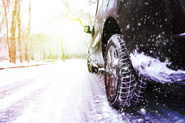 istock Modern car with winter tires on snowy road 1314494632