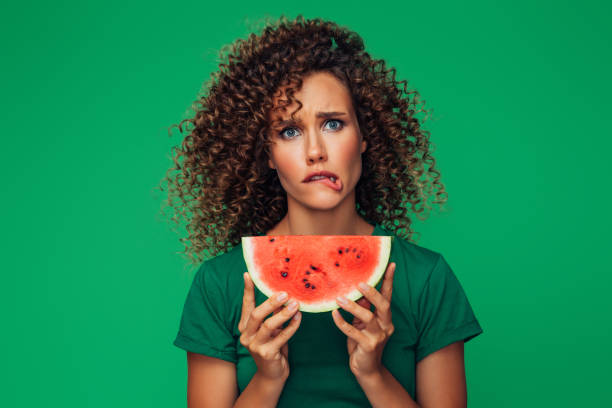 istock Studio portrait of a beautiful girl with watermelon 1314494792