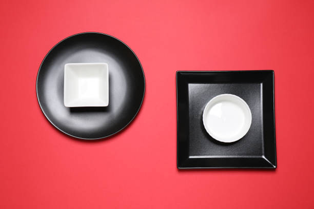istock Set of ceramic dishware on red background, flat lay 1314494925