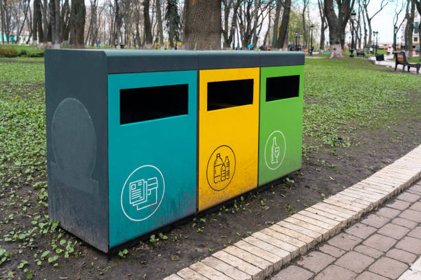 istock sorting containers for glass, plastic and paper waste. garbage sorting on the street. 1314495733