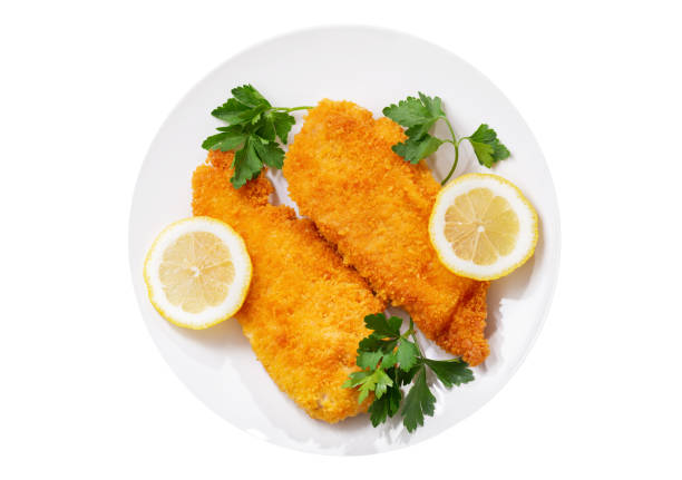 istock plate of chicken schnitzel isolated on white background 1314496003