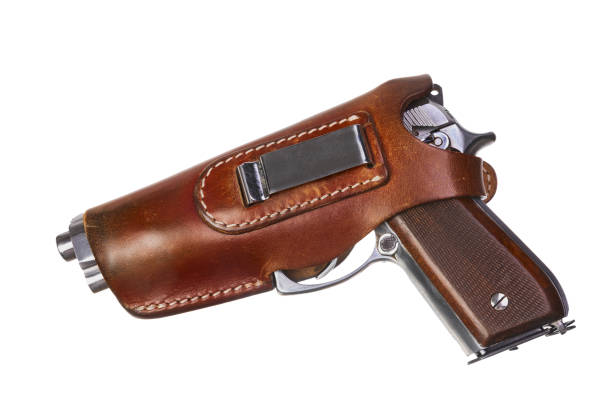 istock Pistol in leather holster turned left side 1314496845