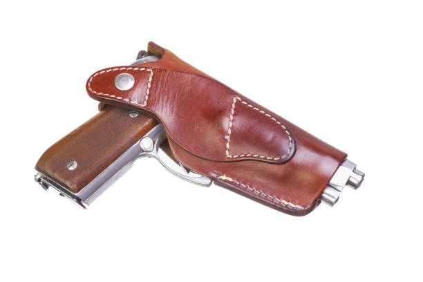 istock Pistol in leather holster turned right side 1314497599