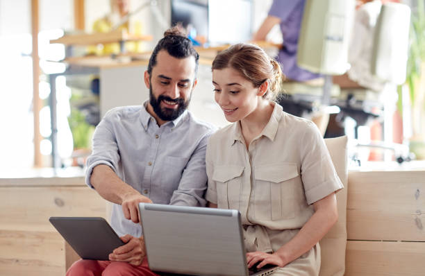 istock creative team with tablet pc and laptop in office 1314497676