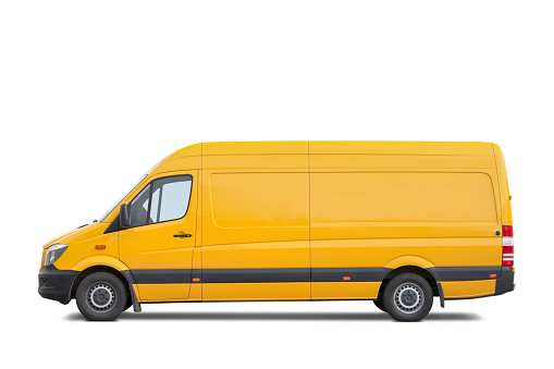 Side view of a large yellow van isolated on white. Includes clipping path.