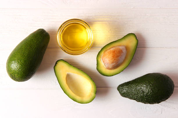 istock Avocado and avocado oil close up on the table 1314499444