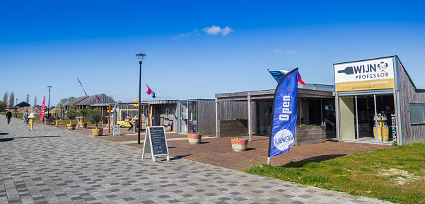 Panorama of little shops in the harbor ditrict of Blauwestad, Netherlands