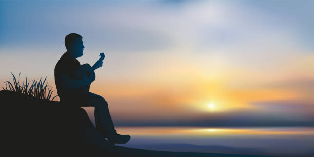 A man plays guitar in front of the ocean at sunset. Concept of inspiration and meditation with a single musician, who plays the guitar sitting in front of a sunset over the ocean. plage stock illustrations