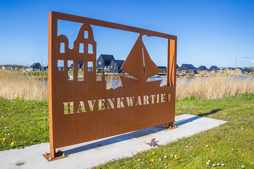 Rusty entrance sign of the harbor district in Blauwestad, Netherlands