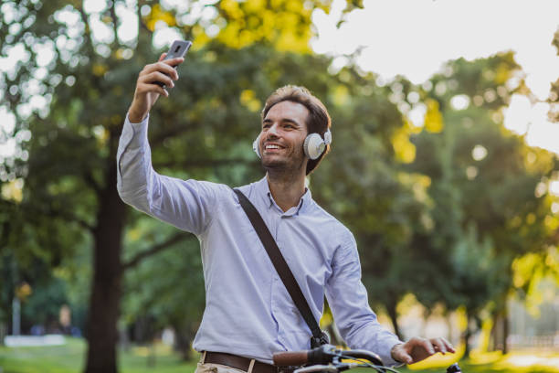 istock Young man on a bicycle is communicating on a video call 1314501523