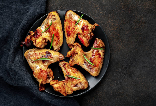 istock grilled chicken wings in a plate on a stone background with copy space for your text 1314502503