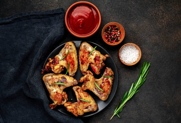 istock grilled chicken wings in a plate on a stone background with copy space for your text 1314502527