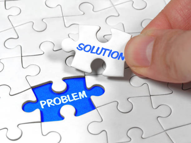 istock Closeup an male hand holding the jigsaw puzzle solution to the problem missing piece. Concept conceptual metaphor imagine. 1314502572