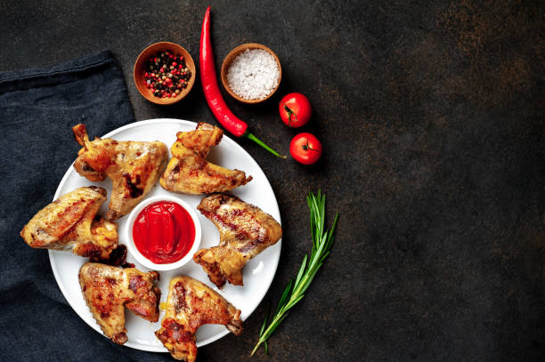 istock grilled chicken wings in a plate on a stone background with copy space for your text 1314502601