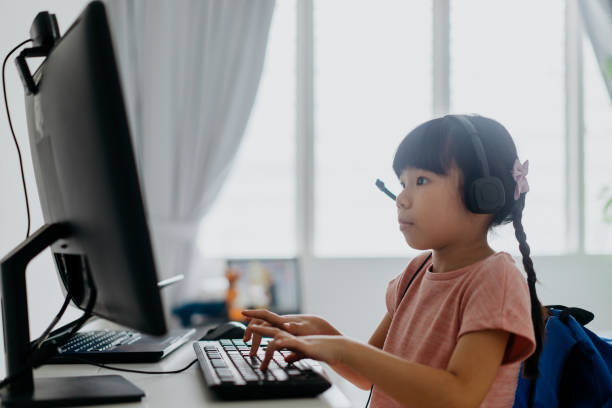 istock Young girl wearing headphone for online study during homeschooling 1314504216
