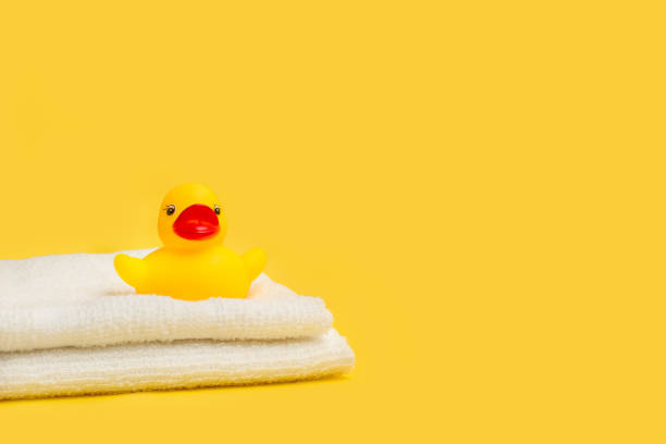 istock A yellow rubber toy duck on white towels 1314504354