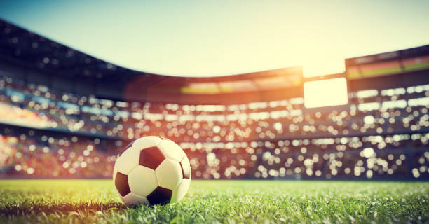 balón de fútbol en el césped del estadio - evento internacional de fútbol fotografías e imágenes de stock