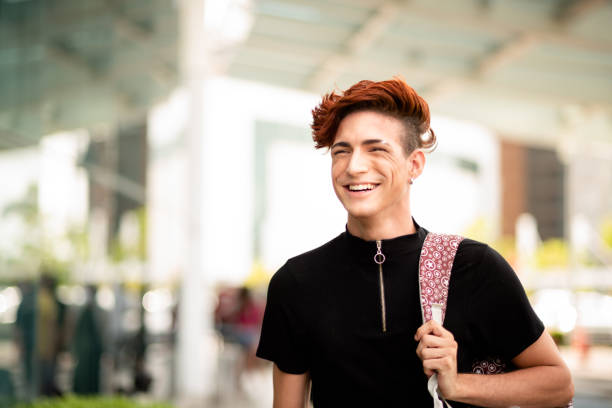 istock Smiling young man standing with a backpack in the city 1314505619
