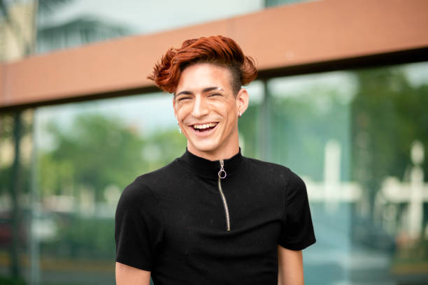 istock Young man laughing while standing outside on a city street 1314506307