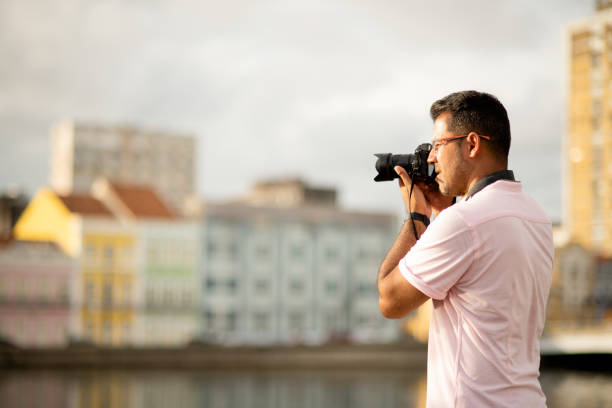 istock Man taking photos while exploring the city on foot 1314506467