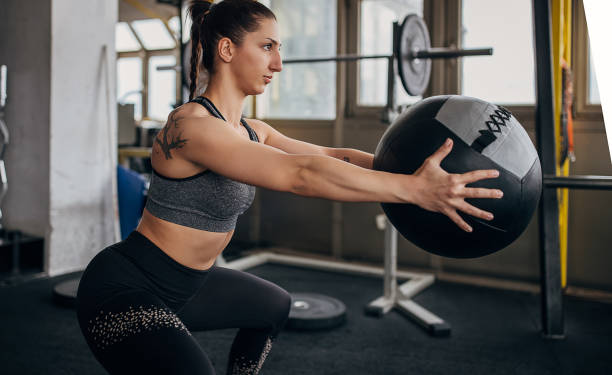 istock Woman training with medicine ball 1314506617