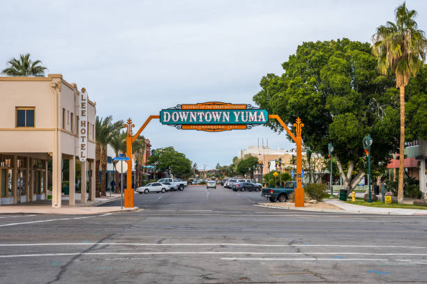 An entrance road going in Yuma, Arizona Yuma, AZ, USA - December 22, 2019: A welcoming signboard at the entry point of the city yuma photos stock pictures, royalty-free photos & images
