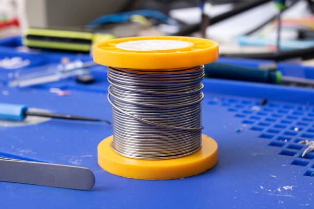 istock Solder coil on silicone soldering mat closeup 1314507676