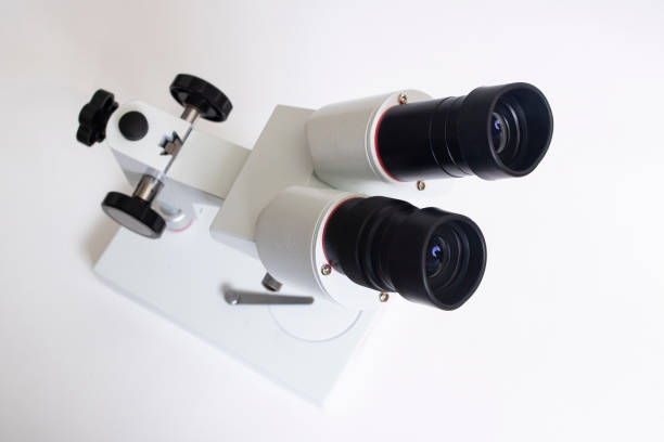 gray medical microscope on a white background - microscope view imagens e fotografias de stock