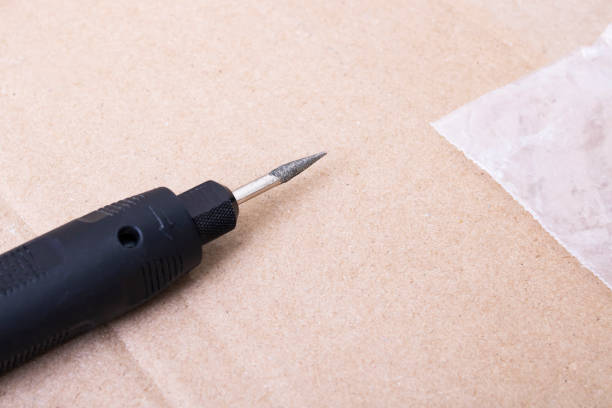 istock Engraver in hand on the desktop background 1314508887
