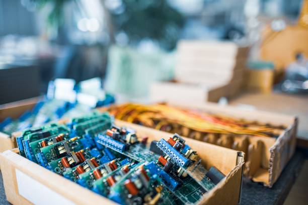 istock Close-up electric green embedded microcircuits in production 1314509314