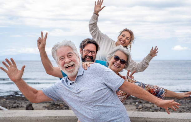 istock Happy playful group of family multi-generation, four people gesturing looking at camera 1314509606
