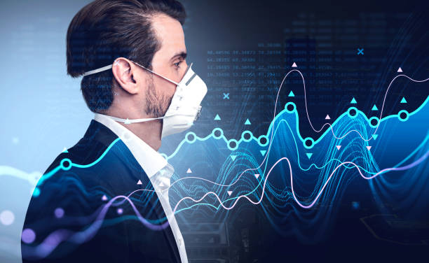 istock Man in suit and protective mask, graph lines and numbers 1314510630