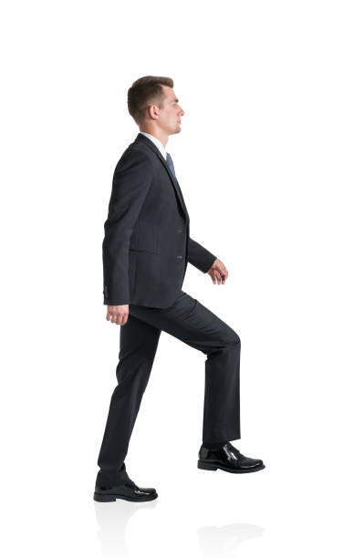 istock Young businessman is going up, isolated over white background 1314510649