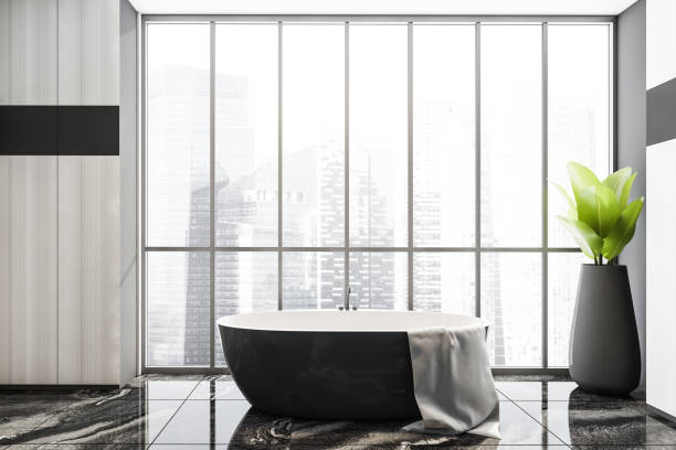 istock Grey bathtub and window with city view 1314511561