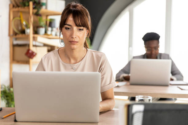 istock Businesswomen working on their laptops at the office 1314512670