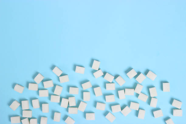 istock Refined sugar on a colored background. Diabetes concept, excess sugar 1314512844
