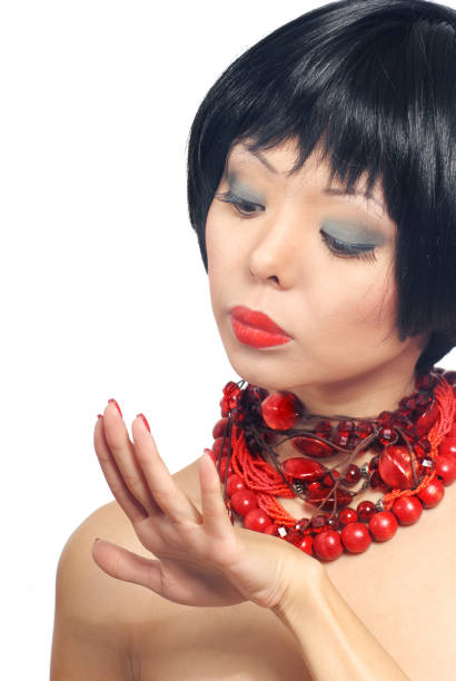 istock Stylish woman with perfect make-up looking at her nails 1314512898