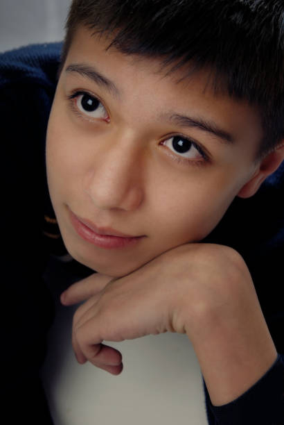 istock Young boy lying on the table and day dreaming 1314512966