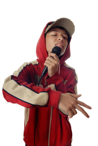 Young boy in rapper clothes singing a hip-hop