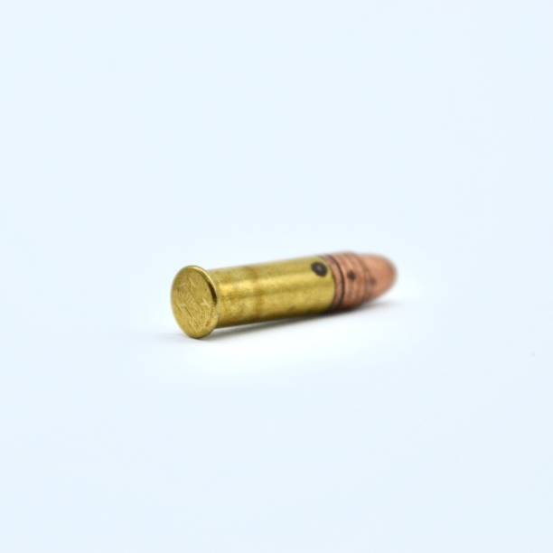 istock Single .22 bullet with a copper nose in studio shot on white background 1314513137