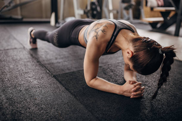 istock Fit woman exercising in plank position 1314516972