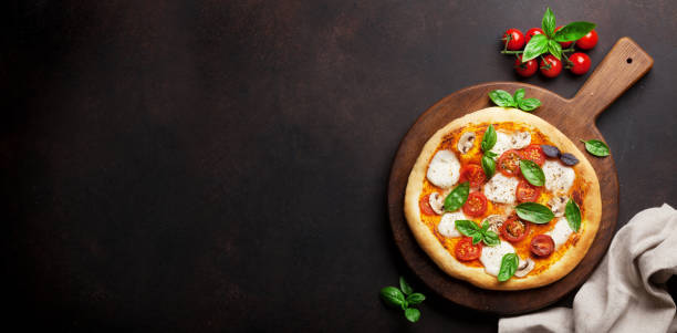 istock Italian pizza with tomatoes, mozzarella and basil 1314517905