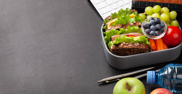 istock Healthy office lunch box with sandwich and fresh vegetables 1314518303