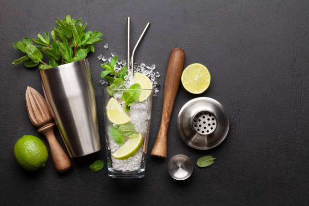 istock Mojito cocktail making. Ingredients and drink utensils 1314518437