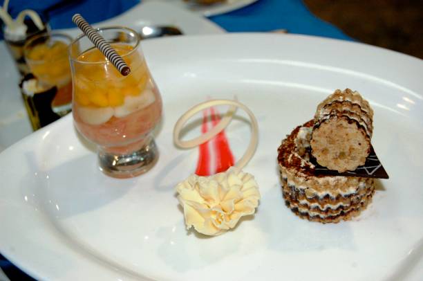 Durian Walnut Marjollaine dessert served on a white plate