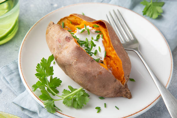istock baked sweet potato with yogurt sausce on white plate 1314522650